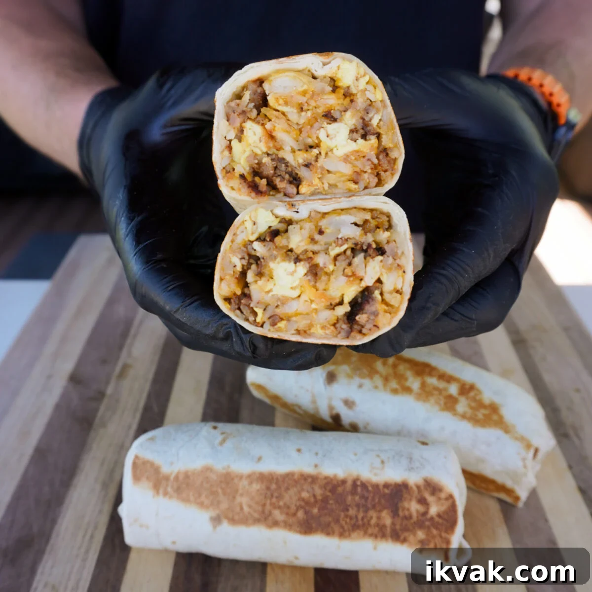 The ultimate breakfast burrito held.
