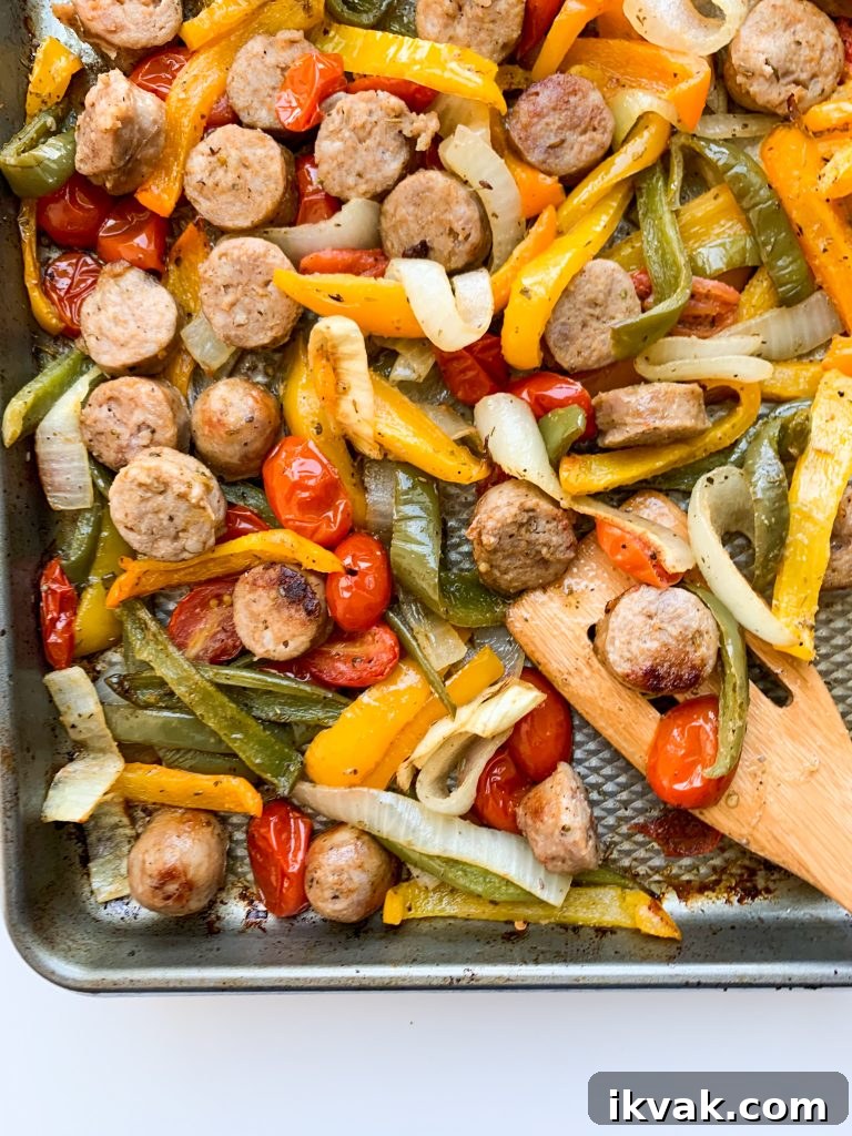 Sheet Pan Sausage and Peppers Dinner Recipe 4 Ingredients on a sheet pan