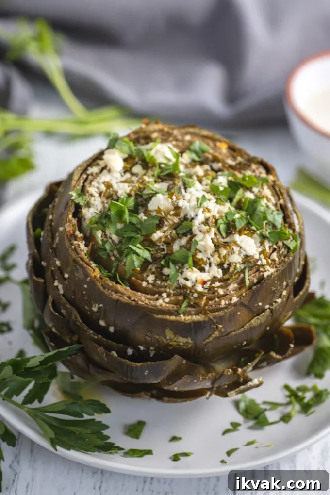 Mediterranean-Style Baked Artichokes with Lemon and Herbs 2 Mediterranean Baked Artichokes topped with feta and parsley