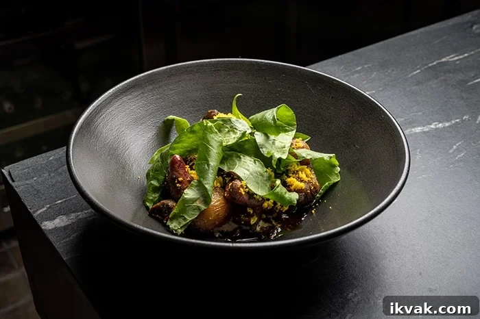 Chicken hearts with richy potatoes, suero costeño, pickled onions, chili, sorrel leaves and egg yolk.