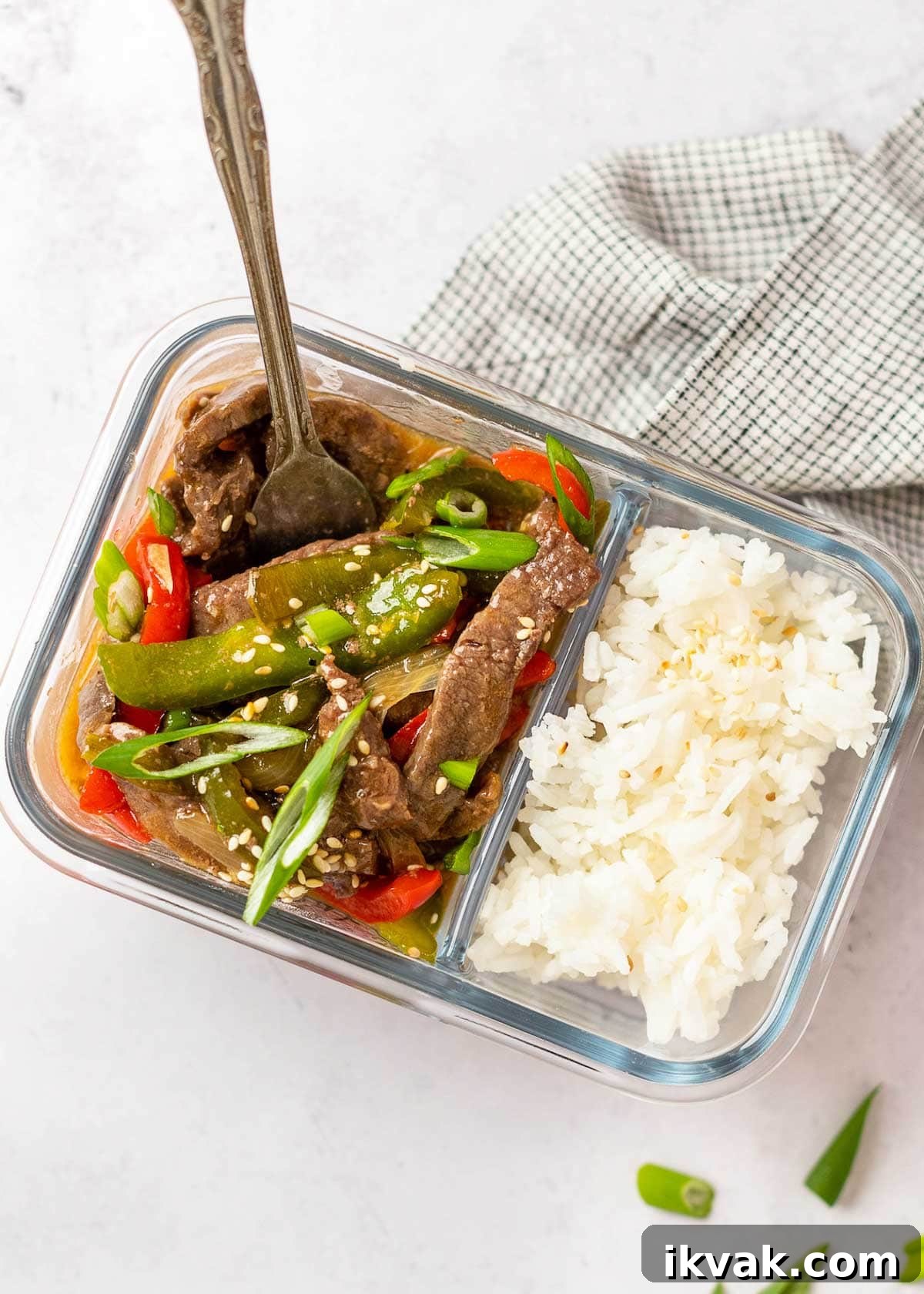 pepper steak in meal prep container with rice
