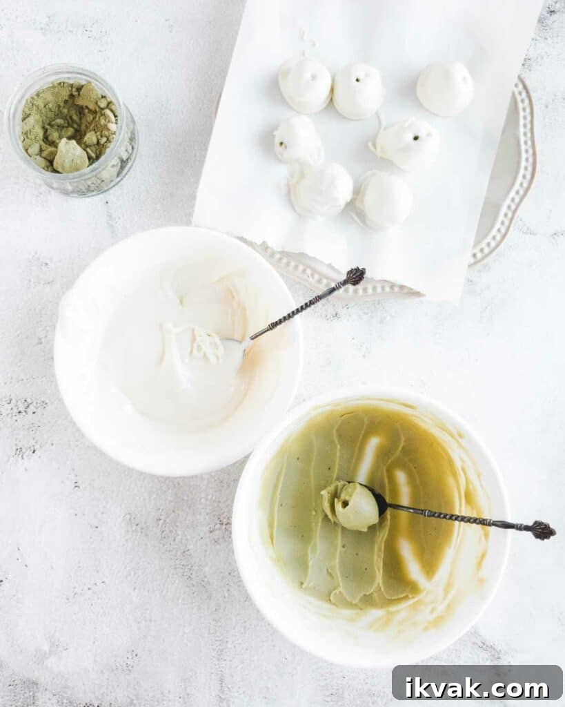 scooping and dipping the matcha truffles in white chocolate