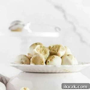 bitten matcha truffles on a plate