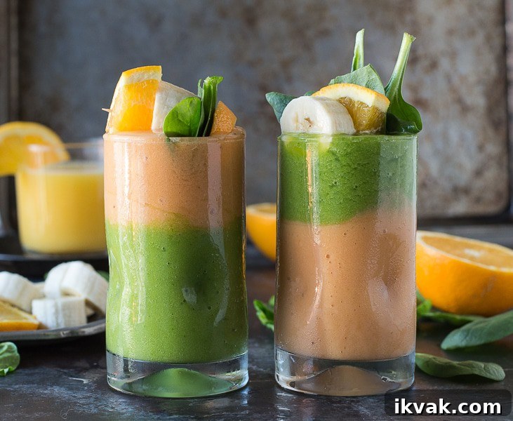 Two layer green monster orange smoothie - healthy and easy to make! Top the smoothie with a fruit skewer. 
