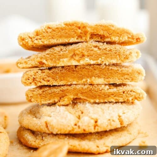 A stack of browned butter peanut butter cookies cut in half.