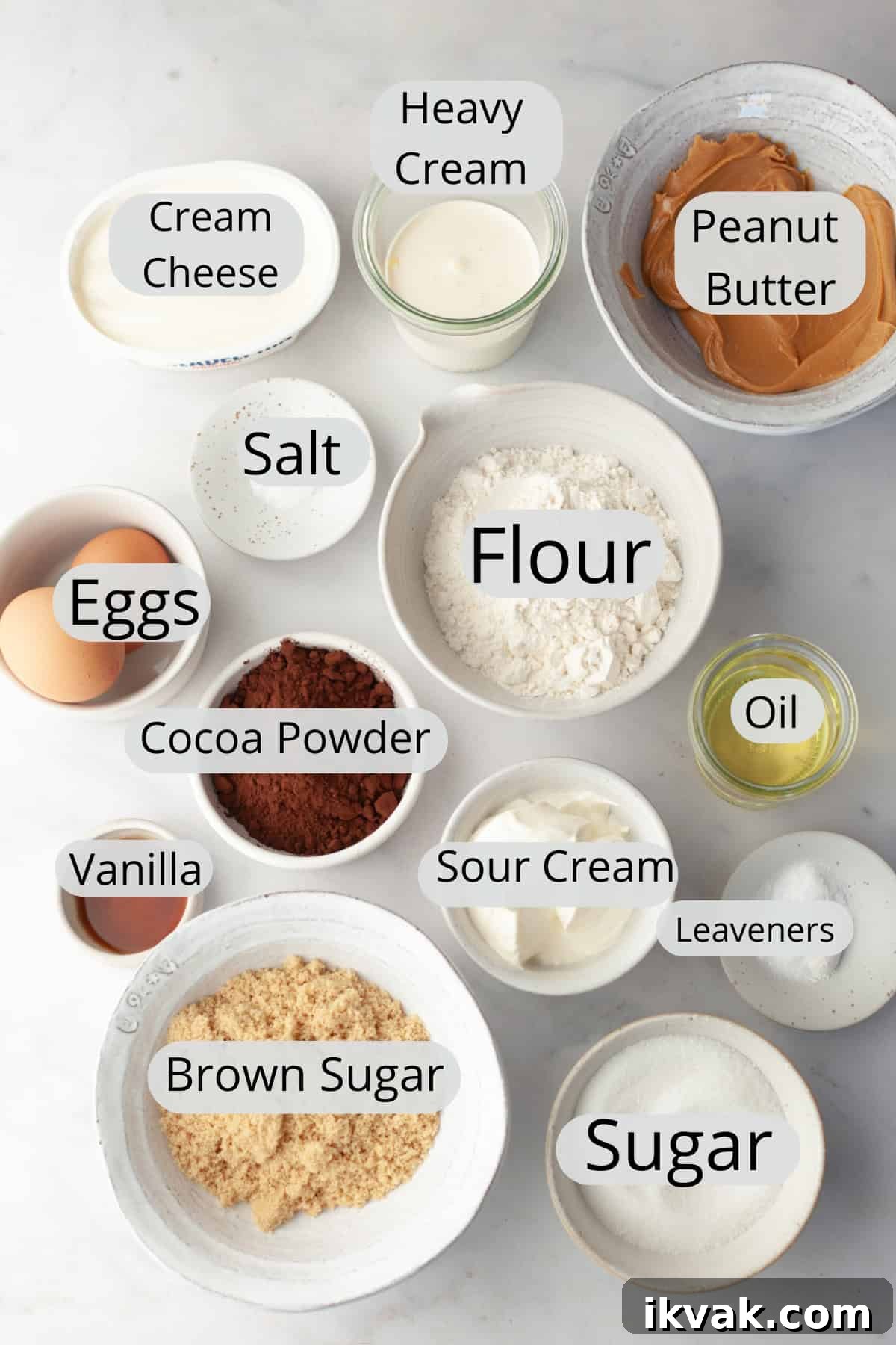 All the ingredients needed to make chocolate peanut butter cup cupcakes, weighed out into small bowls.