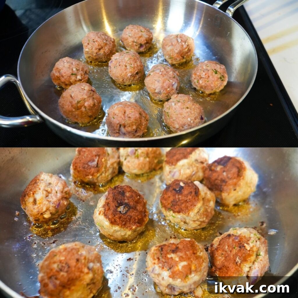 Greek turkey meatballs cooking in a skillet.