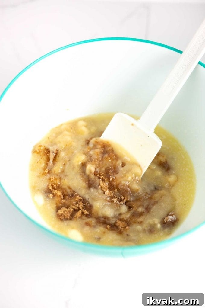 Stirring banana bread batter with spatula