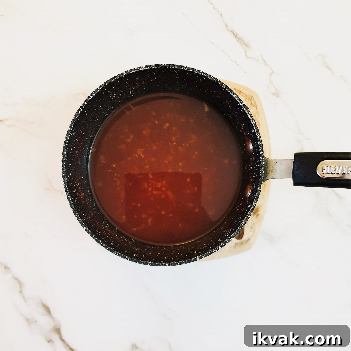 A saucepan of Durky sauce ready to be poured over the chicken wings.