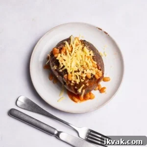 Air Fryer Jacket Potato topped with beans and cheese.