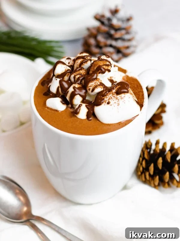 creamy homemade hot chocolate with marshmallows and chocolate syrup