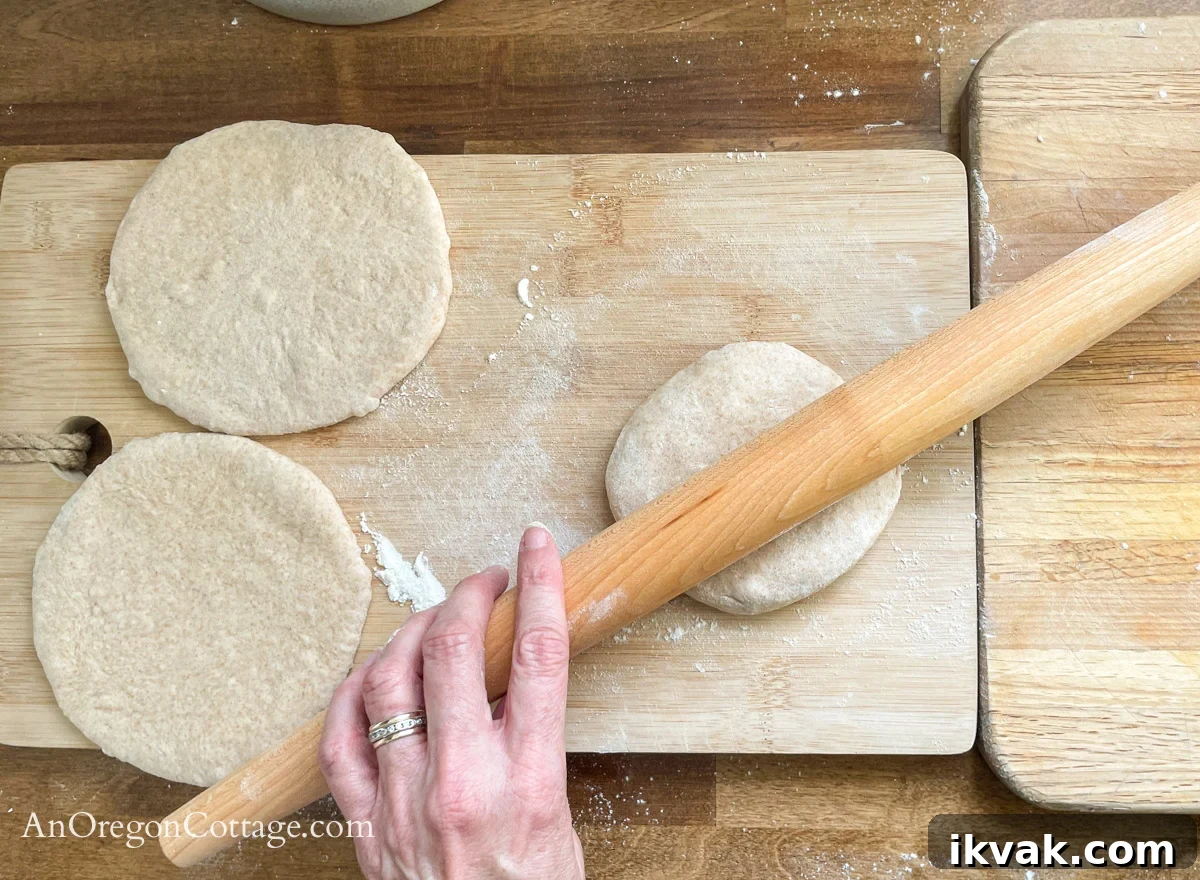 Homemade Whole Wheat Pita Bread Recipe — Soft & Fluffy 11 rolling pita dough balls