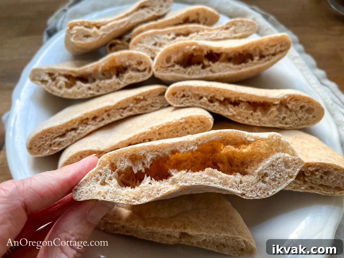 Homemade Whole Wheat Pita Bread Recipe — Soft & Fluffy 15 cooked pita bread pocket close