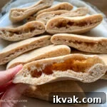Homemade Whole Wheat Pita Bread Recipe — Soft & Fluffy 16 cooked pita bread pocket close