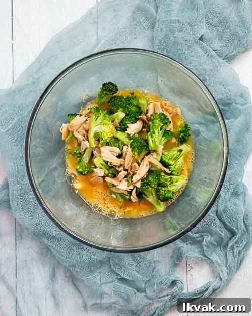 Keto Egg Foo Young Recipe: Low-Carb Chinese-Style Omelette 11 Mixing the chicken veggies and eggs.