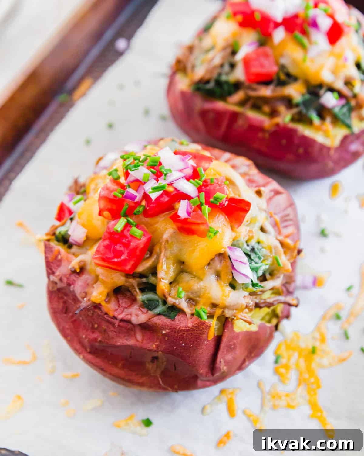 Soft, tender baked potatoes filled with BBQ brisket and loaded with cheesy toppings.