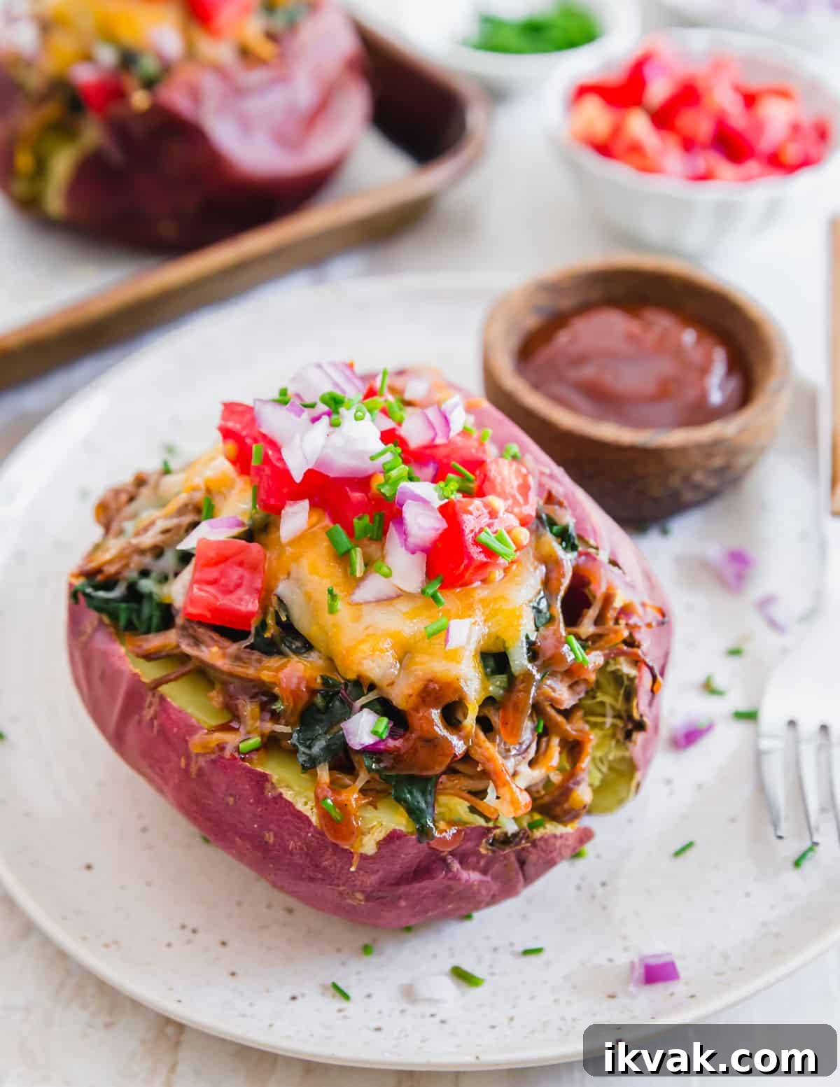 Use up leftover beef brisket in these easy baked brisket potatoes. Fill them with your favorite toppings, lots of cheese and a side of extra BBQ sauce for an easy dinner.