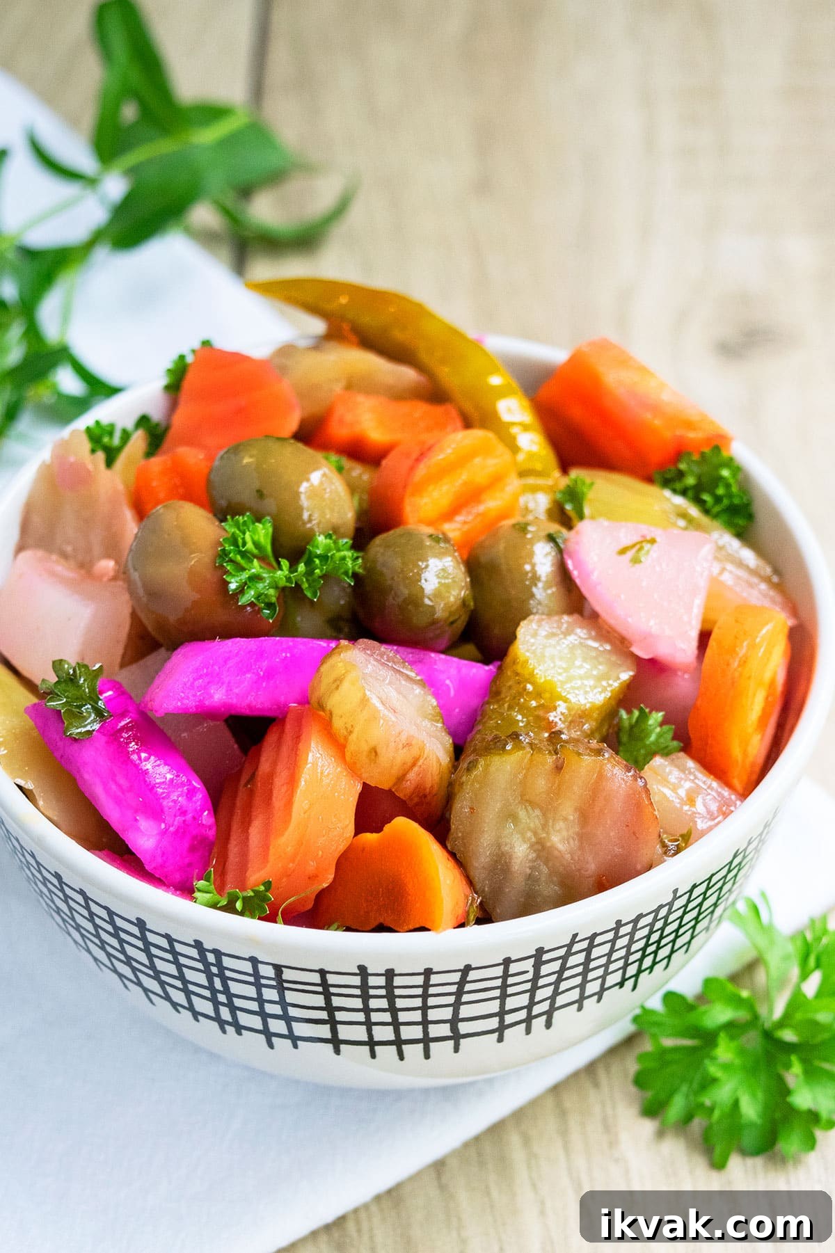 One-Pot Quick Pickled Vegetables for Crispy, Tangy Snacks 4 Easy refrigerator pickles in white bowl.