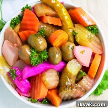One-Pot Quick Pickled Vegetables for Crispy, Tangy Snacks 6 Quick Easy Homemade Refrigerator Pickled Vegetables in white bowl.