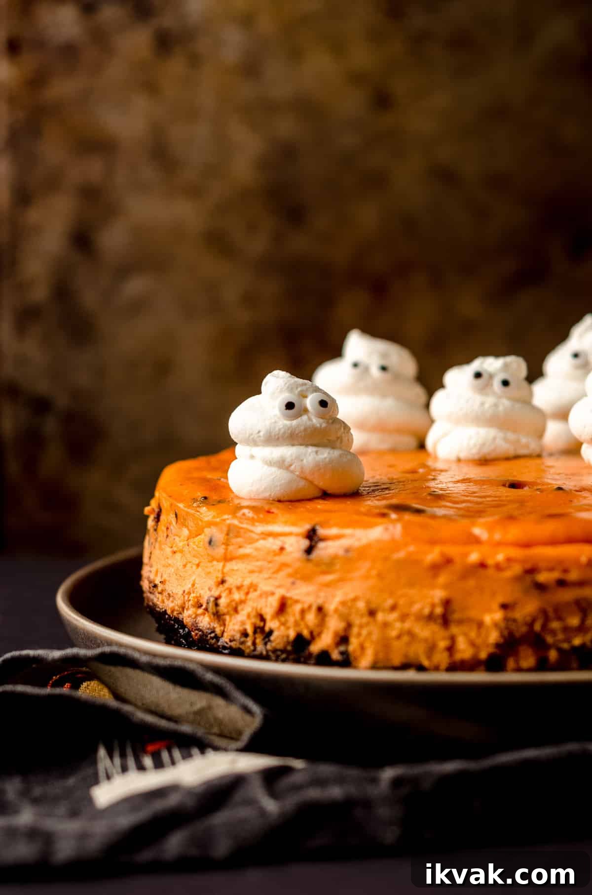 halloween cheesecake with whipped cream ghosts