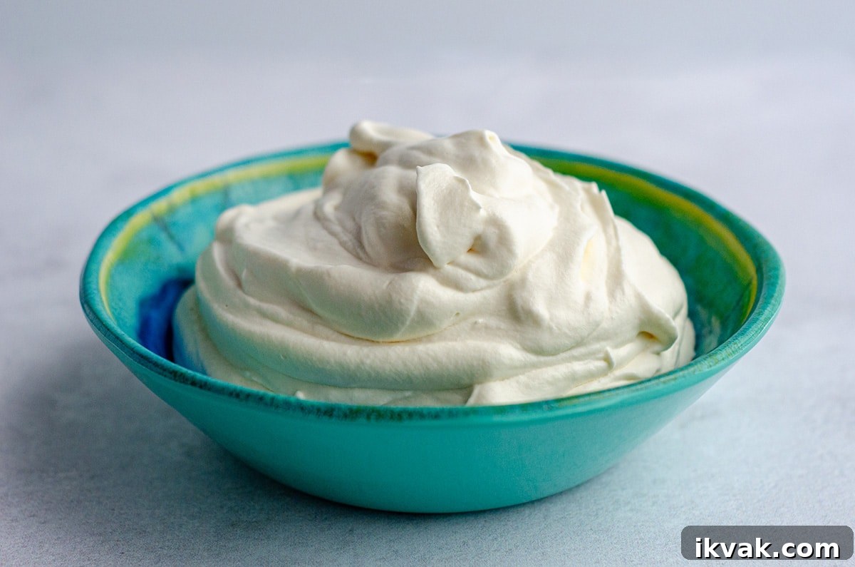 homemade whipped cream in a blue and green bowl