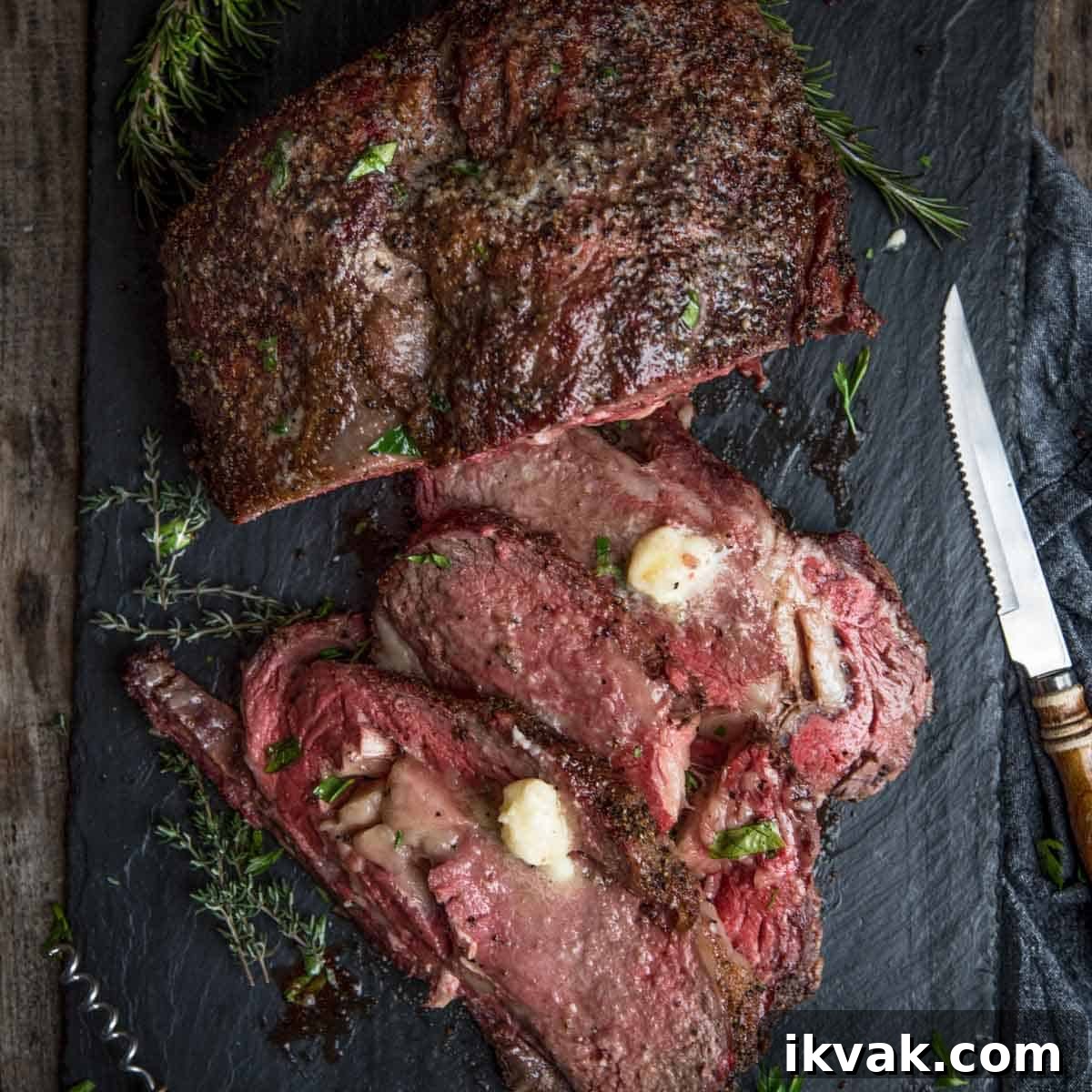 Carryover Cooking: What It Is and How It Affects Meat Doneness 4 Boneless Smoked Prime Rib on a platter topped with horseradish butter