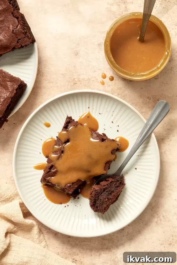 Milk Free Caramel Sauce drizzled over chocolate brownies.