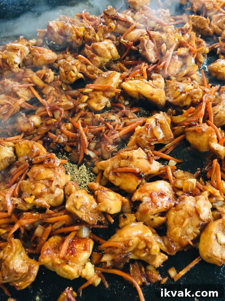 chicken and veggies cooking on the Blackstone