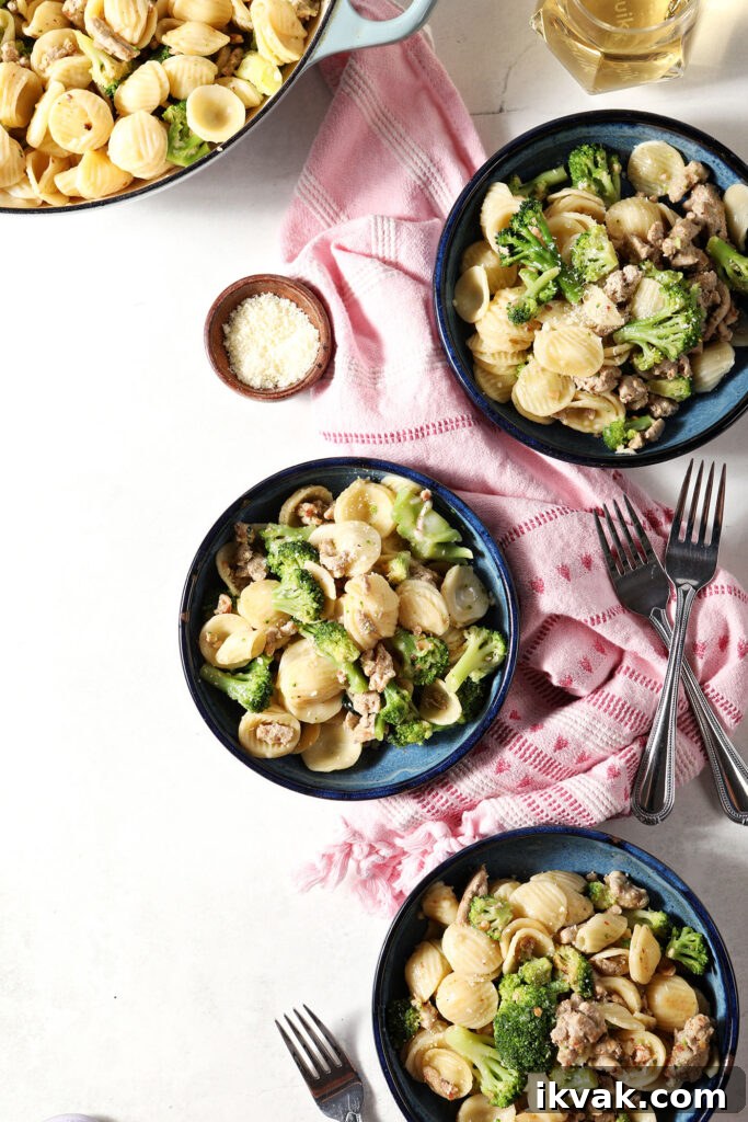 Orecchiette with Ground Turkey and Broccoli — Quick Weeknight Pasta 8 Three blue bowls of Turkey Broccoli Orecchiette pasta next to a pink linen on a marble surface