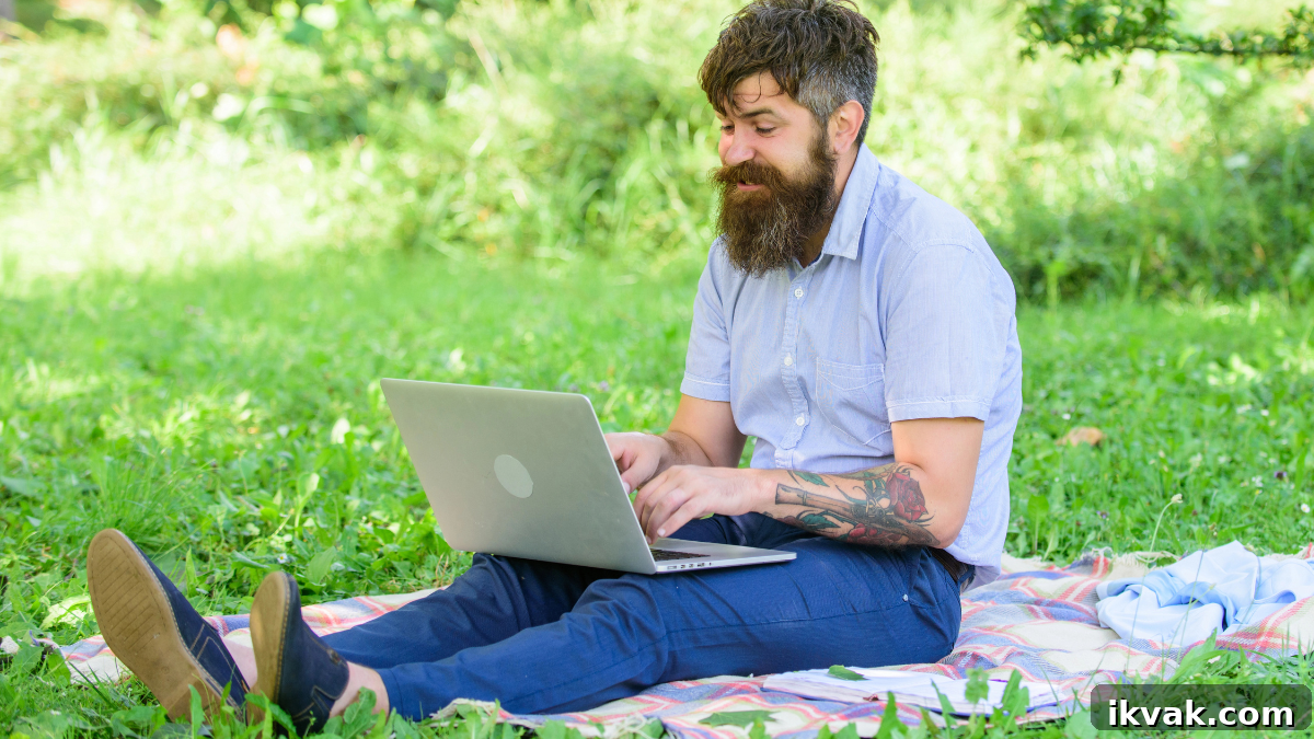 man writing on computer