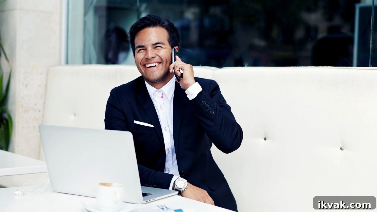 man on phone and computer