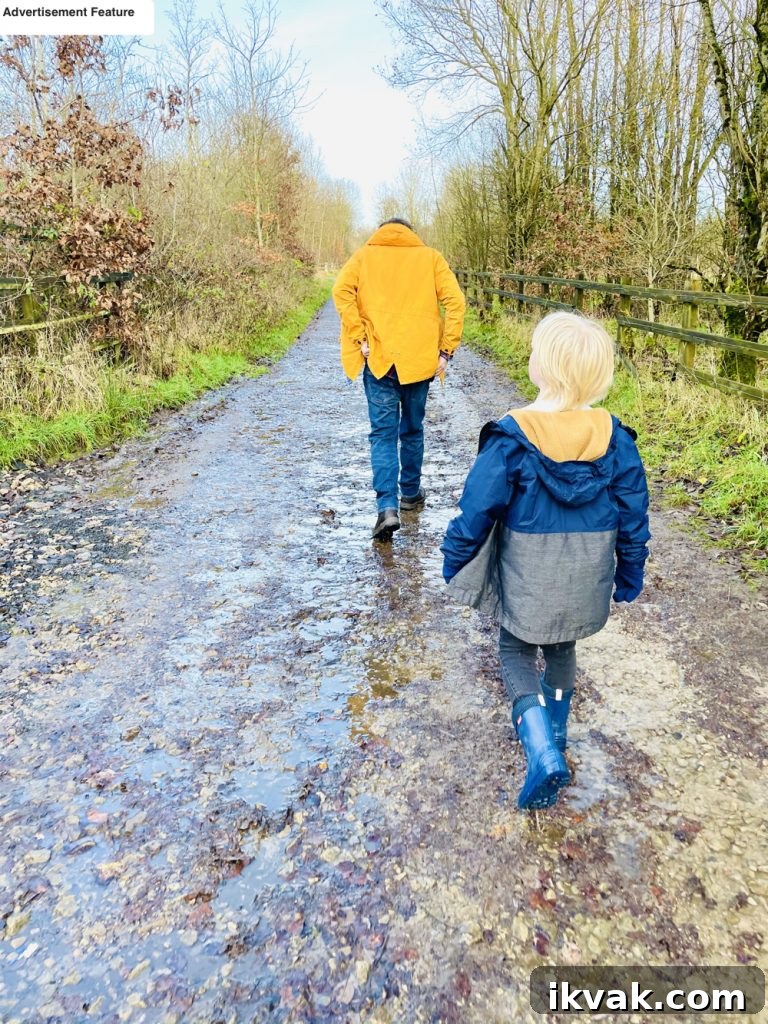 man and boy walking up a hill and getting outdoor exercise 