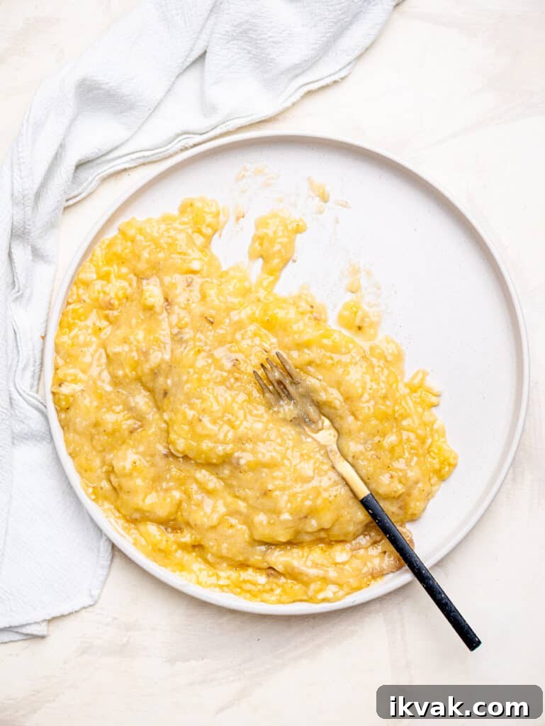 Mash bananas well for the best banana oatmeal muffins.