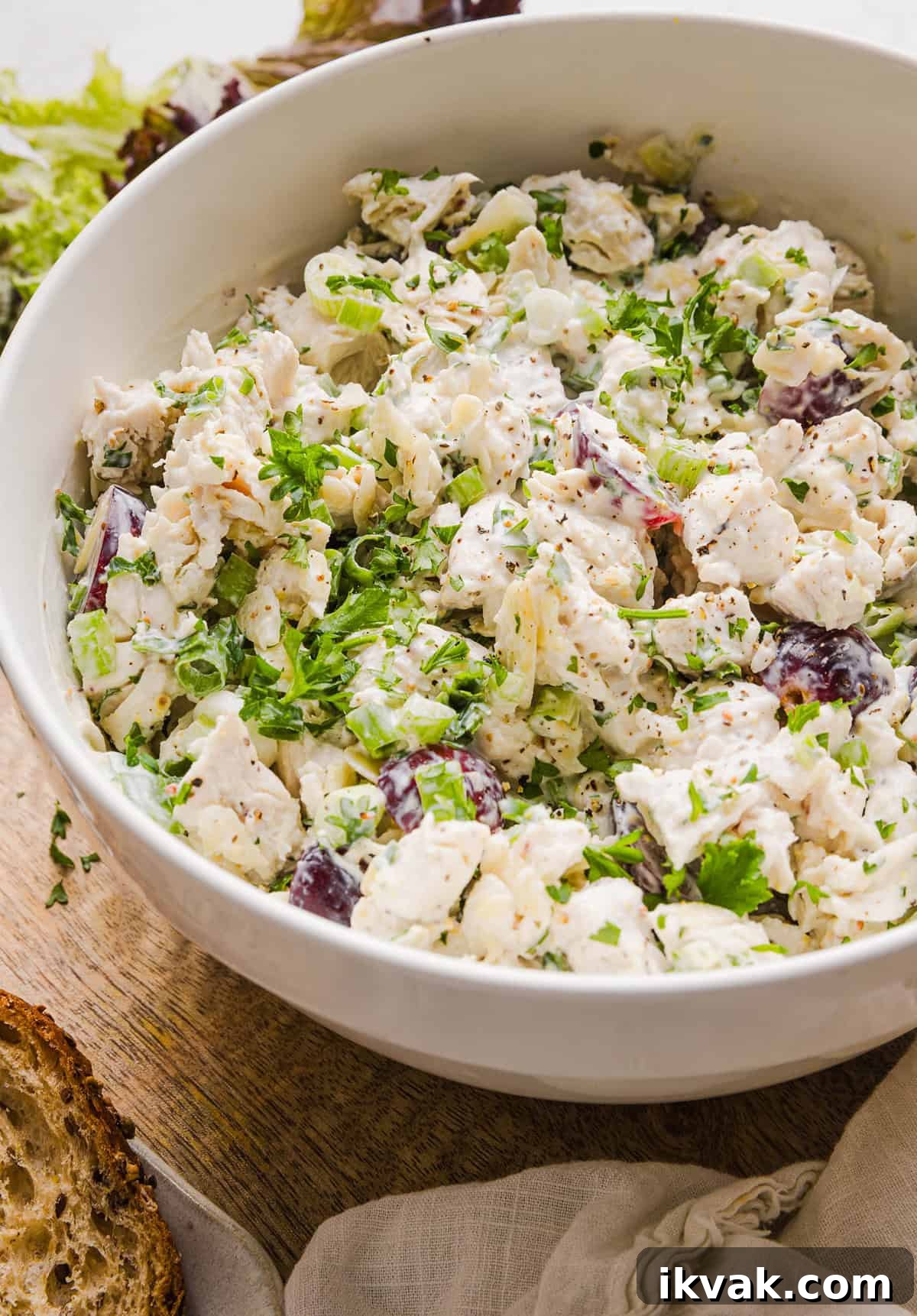 This Healthy Chicken Salad is creamy, fresh and packed with protein! Made with tender chicken, Greek yogurt in place of mayo, crunchy celery, grapes, and sliced almonds for a delicious, easy lunch or meal prep option you'll make on repeat!