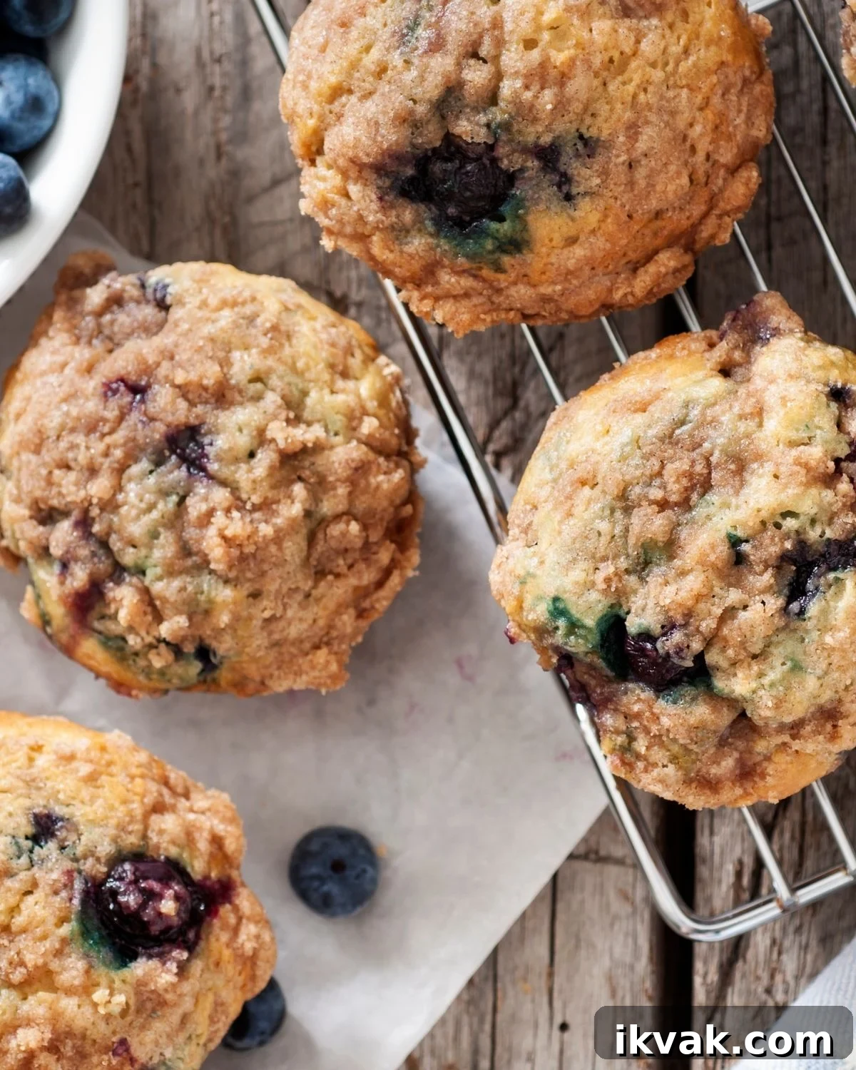 Old Fashioned Blueberry Muffins on a cooling rack.