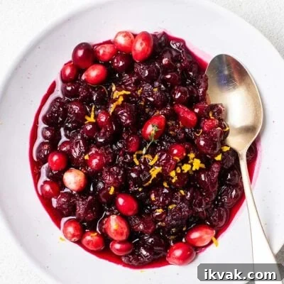 Maple Cranberry Sauce Recipe: Sweet-Tart Holiday Condiment 7 A bowl of homemade cranberry sauce made with maple syrup.