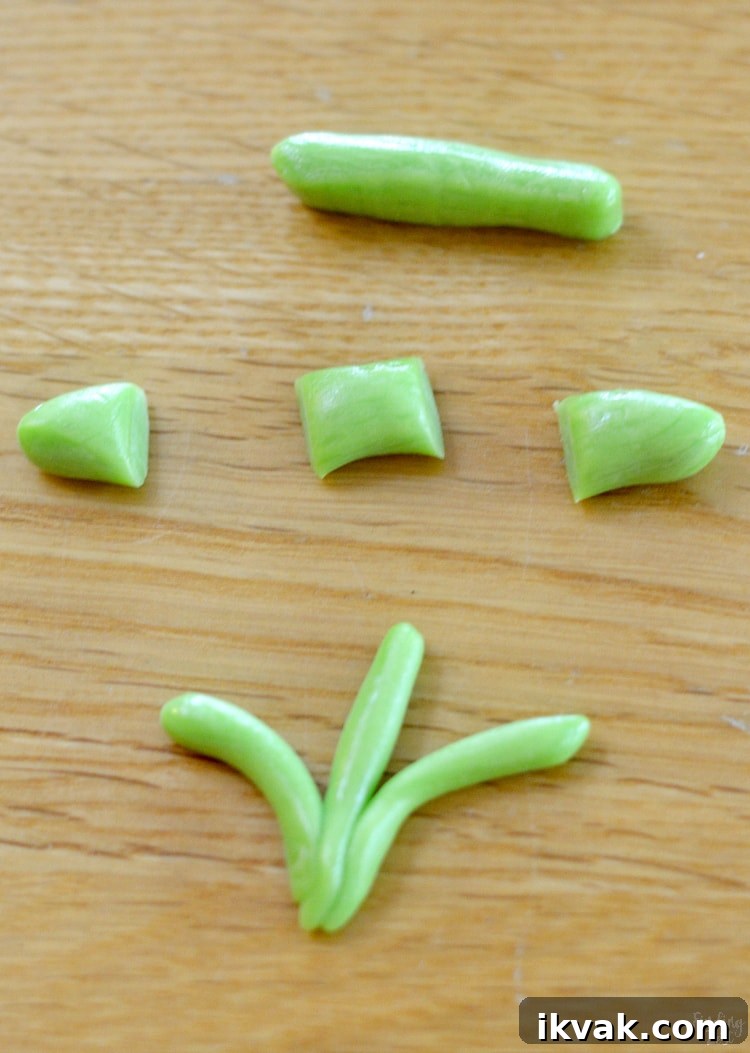 Cut tootsie rolls to make edible grass or reeds