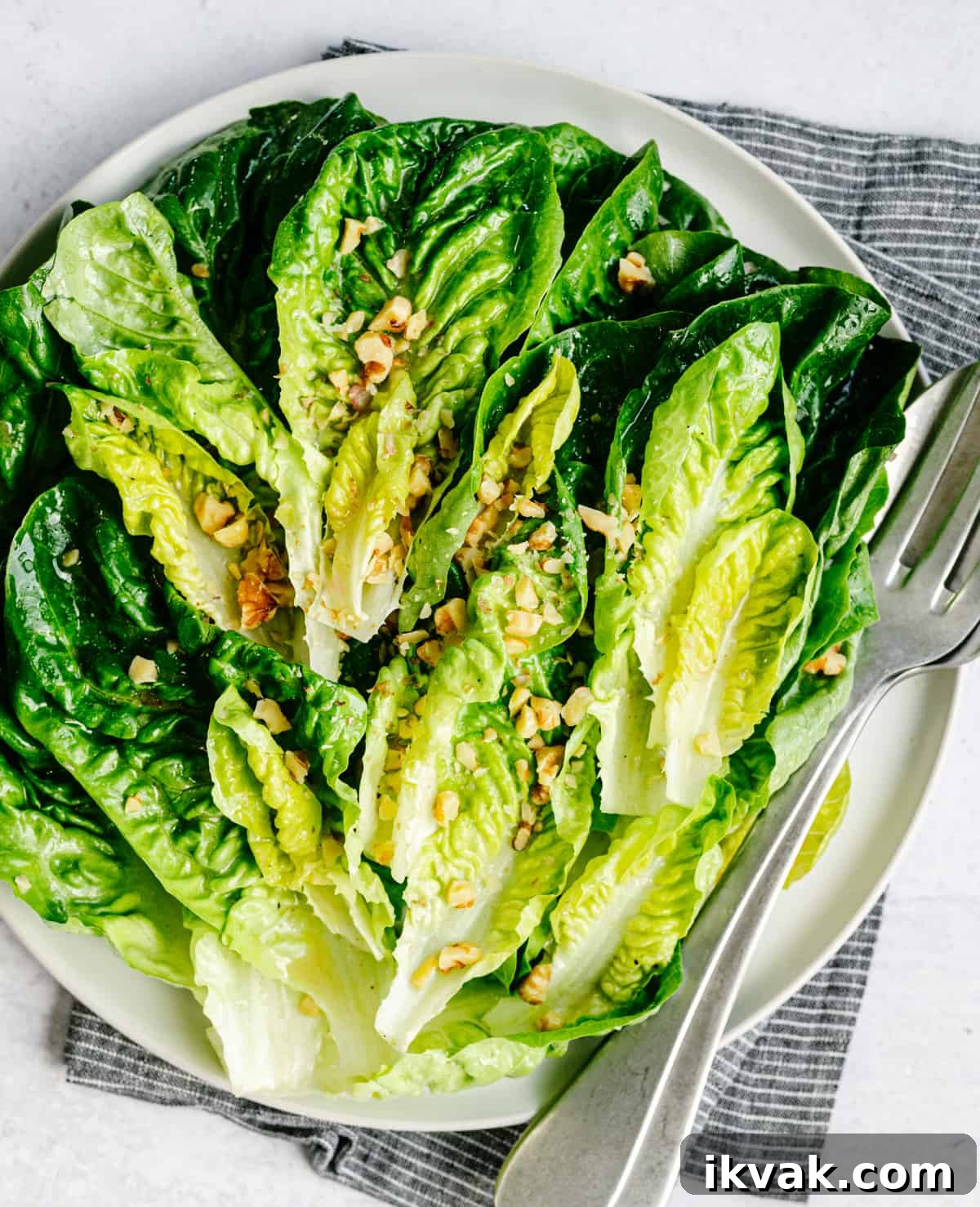 Crisp Little Gem Lettuce Salad with Lemon Vinaigrette 2 Little Gem Salad served on a round white platter and photographed from overhead.