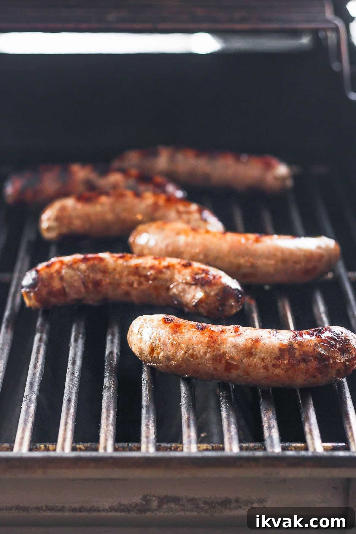 Grilled brats on the grill.