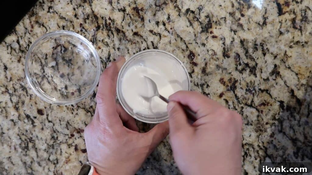 Mixing the water and cornstarch together to form a slurry