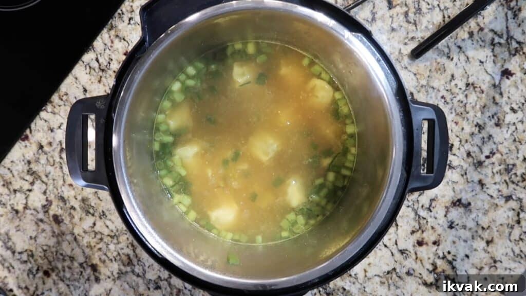 Allowing the wontons to simmer in the soup until cooked