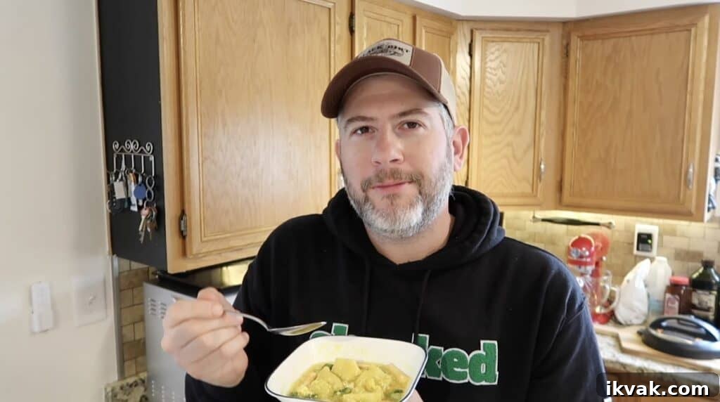 Man looking content with soup.
