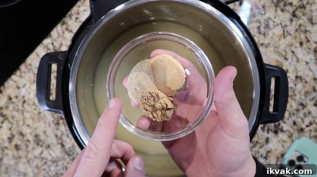 Spices being added to broth