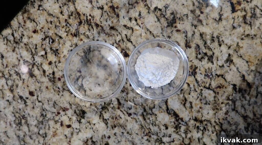 Water and cornstarch in two separate bowls.