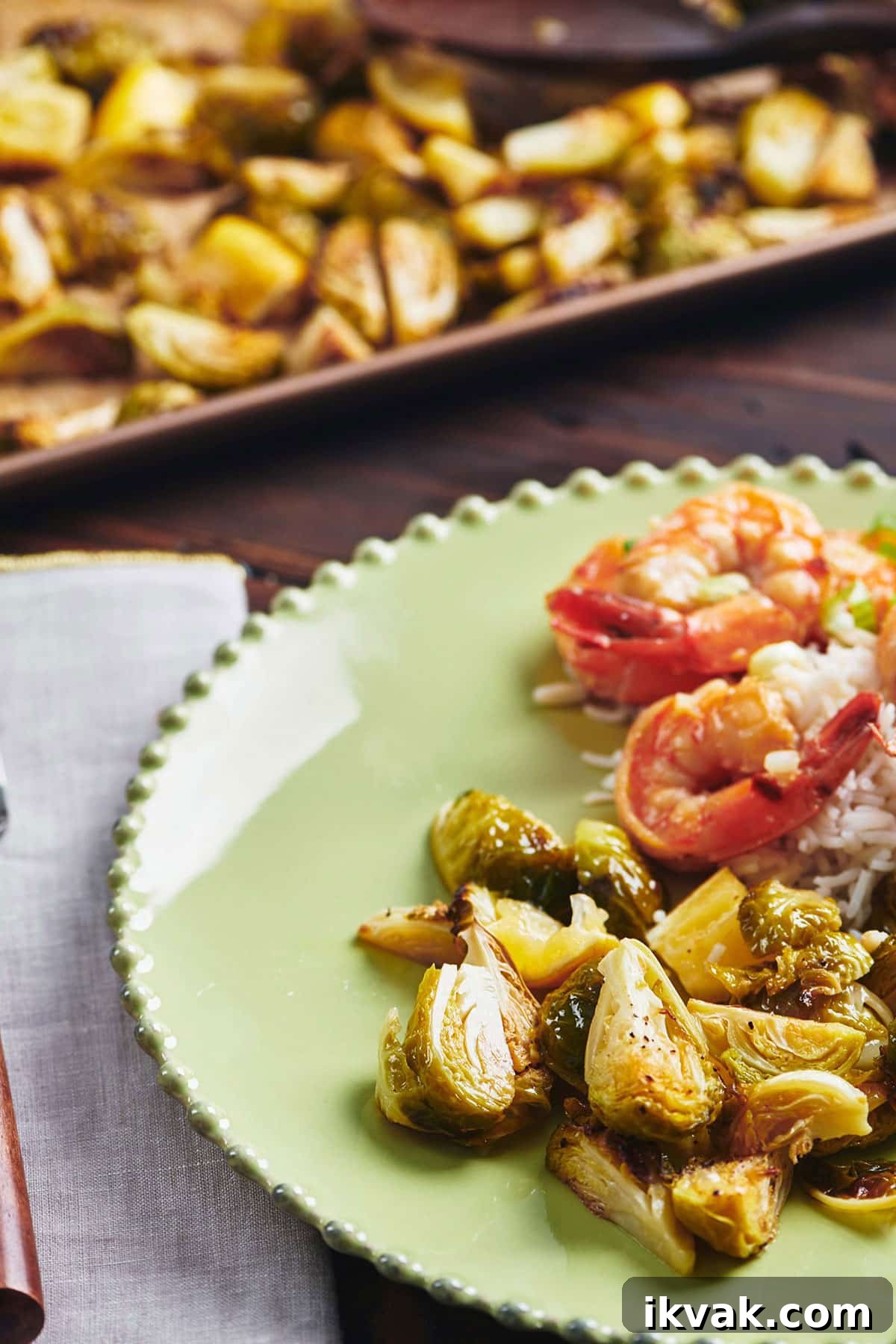 Crispy Roasted Brussels Sprouts: Simple Oven Recipe 7 Roasted Lemon Brussels Sprouts on green plate with shrimp.