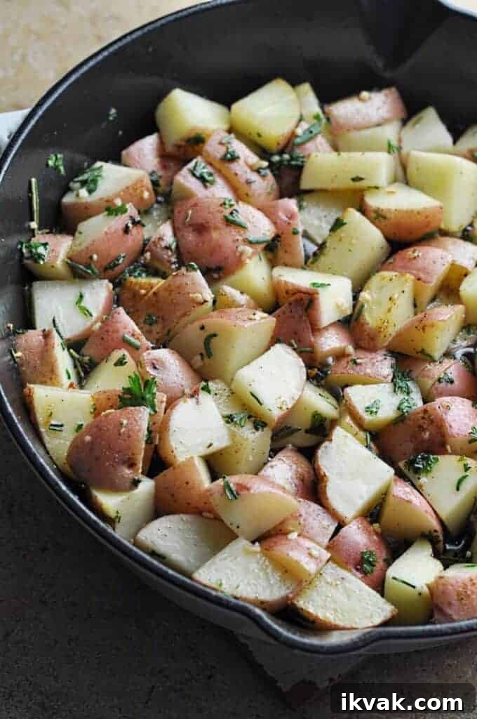 Crispy Cast Iron Potatoes with Bacon and Herbs 4 Potatoes chopped cooking in pan
