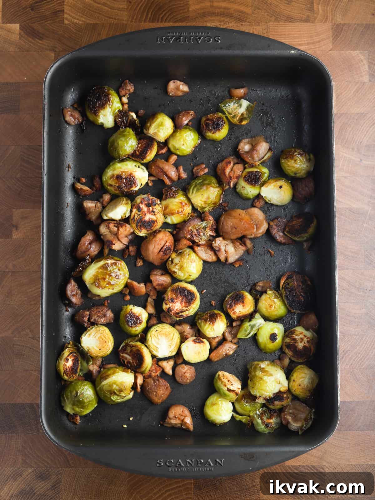 Photo of sprouts and chestnuts in the roasting tin after roasting.