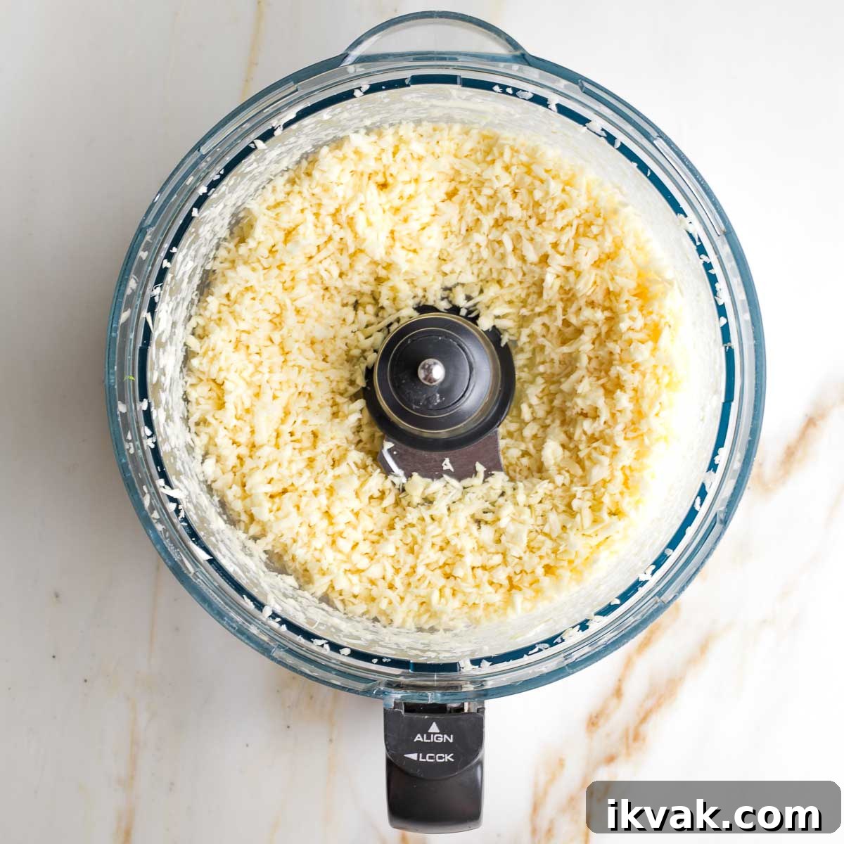 Gluten-Free Tabbouleh with Roasted Parsnips 10 Tiny pieces of parsnips in the bowl of a food processor.