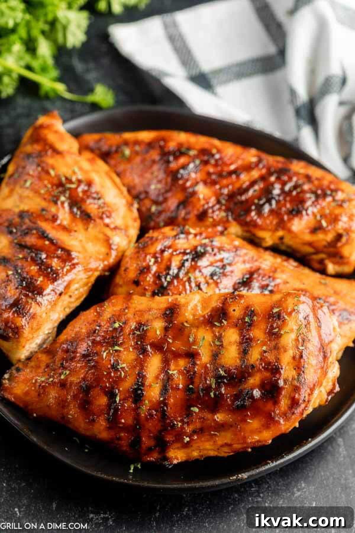 BBQ Chicken Breast stacked on a plate.