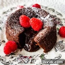 Serve the chocolate lava cakes on a plate with berries.